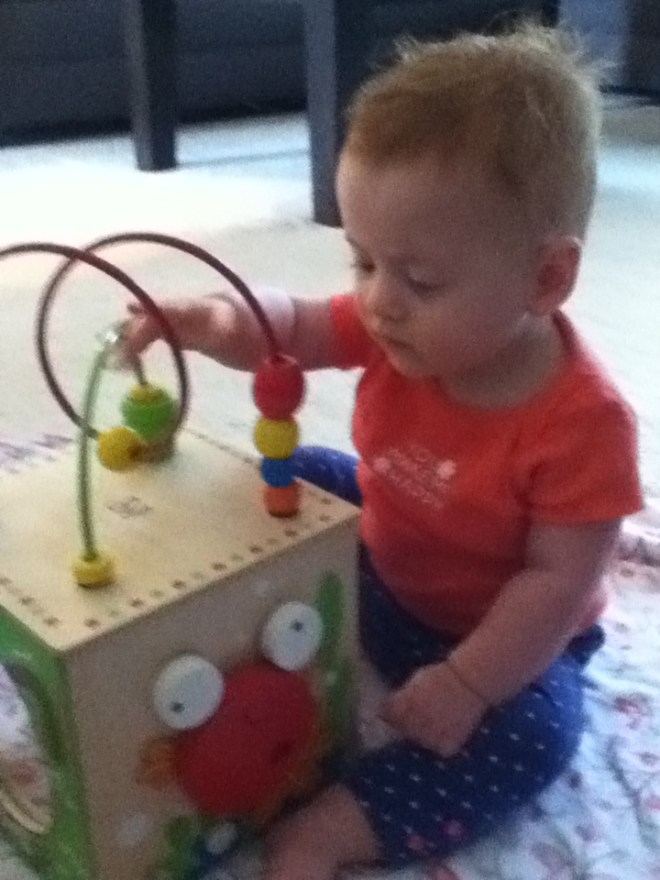 Mommy, put the camera away and come flick beads with me.